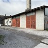 skladišča ob Toplotni postaji (centralna kotlovnica za ogrevanje celotnih delavnic). Prvotno je bila tu deponija za premog. Zadaj Armaturna delavnica.